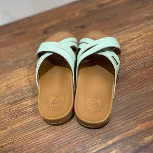 Girls moderately worn Reef sandals size 2